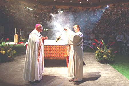 ARchbishop Levada with an altar girl